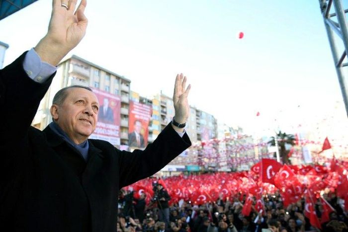 This handout picture released by the Turkish Presidential Press Service on February 17, 2017 shows Turkish President Recep Tayyip Erdogan greeting the audience during a rally
