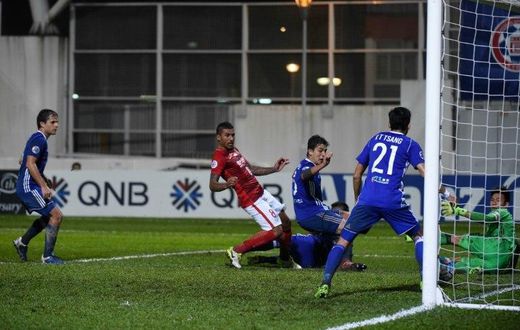 China's Guangzhou Evergrande's midfielder Paulinho (C) scores a goal against Hong Kong's Eastern on April 25, 2017