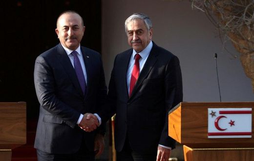 Turkish Cypriot leader Mustafa Akinci (right) holds a press conference with Turkish Foreign Minister Mevlut Cavusoglu after a meeting in the self-proclaimed Turkish Republic of Northern Cyprus (TRNC) on February 21, 2017