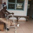 A man who lost his left foot to leprosy, waits for treatment at the Raoul Follereau Foundation facility in Pobe