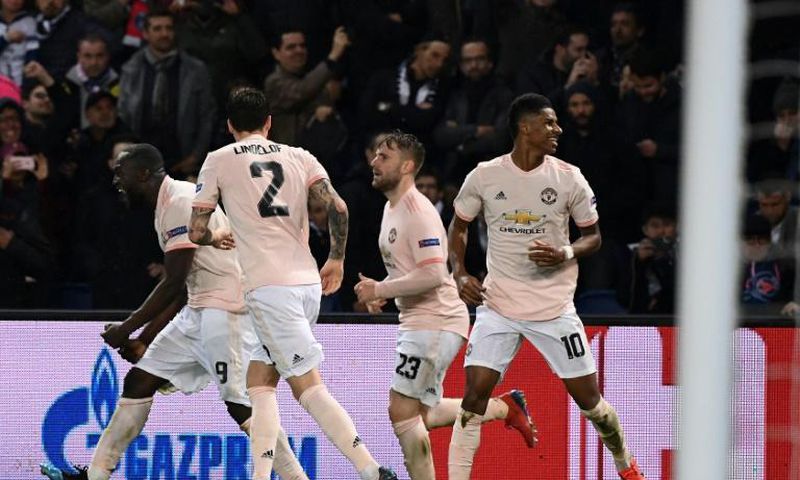 Marcus Rashford celebrates with his teammates after his last-gasp VAR-awarded penalty took Manchester United through at PSG's expense