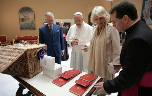 Pope Francis (C) exchanges gifts with Britain's Prince Charles and his wife Camilla, Duchess of Cornwall during a private audience on April 4, 2017 at the Vatican