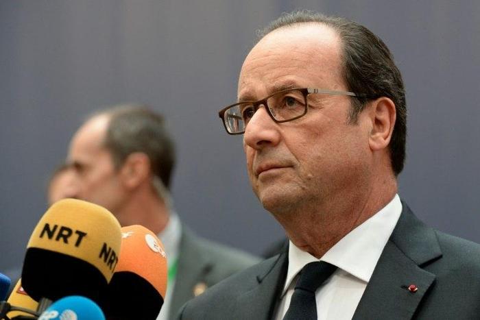 France's President Francois Hollande addresses journalists as he arrives for an European Union leaders summit, at the European Council in Brussels, on October 20, 2016