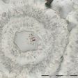 Iron-carbonate (white) rosette with concentric layers of quartz inclusions (grey) and a core of a single quartz crystal with tiny (nanoscopic) inclusions of red hematite from the Nuvvuagittuq Supracrustal Belt are seen in Québec, Canada