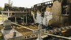 A Charred Gas Can, a Receipt and an Arrest in Church Fires