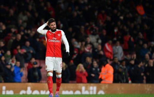Arsenal's French striker Olivier Giroud gestures on the pitch after the English Premier League football match between Arsenal and Bournemouth at the Emirates Stadium in London on November 27, 2016