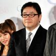 Japanese record producer Yasushi Akimoto (R) is the mastermind behind teeny-boppers Keyakizaka46 and many other similar girl bands, most famously AKB48 (members pictured, L)