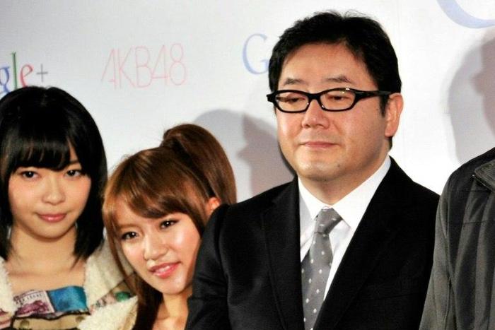 Japanese record producer Yasushi Akimoto (R) is the mastermind behind teeny-boppers Keyakizaka46 and many other similar girl bands, most famously AKB48 (members pictured, L)
