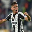 Juventus' forward Paulo Dybala celebrates after scoring during their Champions League quarter-final first leg match against Barcelona in Turin, on April 11, 2017