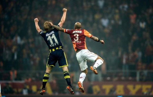 Rivalry between the Turkish football teams Fenerbahce (blue) and Galatasaray (red) dates back almost a century, with sides partly being decided by their geography in reference to the Bosphorus strait