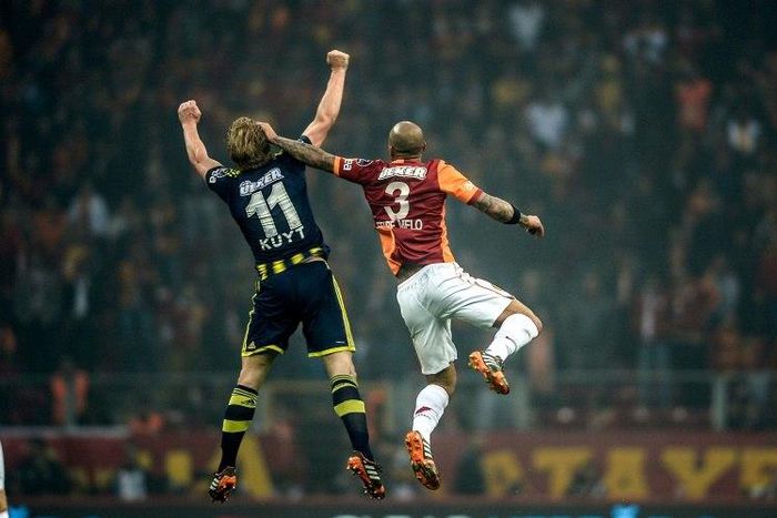 Rivalry between the Turkish football teams Fenerbahce (blue) and Galatasaray (red) dates back almost a century, with sides partly being decided by their geography in reference to the Bosphorus strait