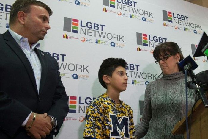 New York LGBT Network CEO David Kilmnick (L), looks on as Lauren Bocketti (R) and her transgender son Zach (C) speak at a press conference on February 23, 2017 in Woodbury, New York