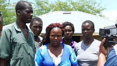 Sharon Otieno's father Douglas Otieno (left) and mother Melida Auma (centre) joined by their relatives