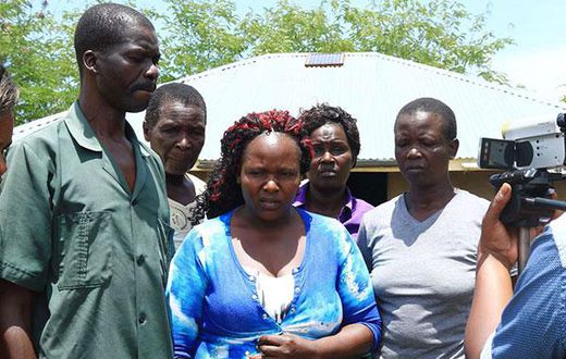 Sharon Otieno's father Douglas Otieno (left) and mother Melida Auma (centre) joined by their relatives
