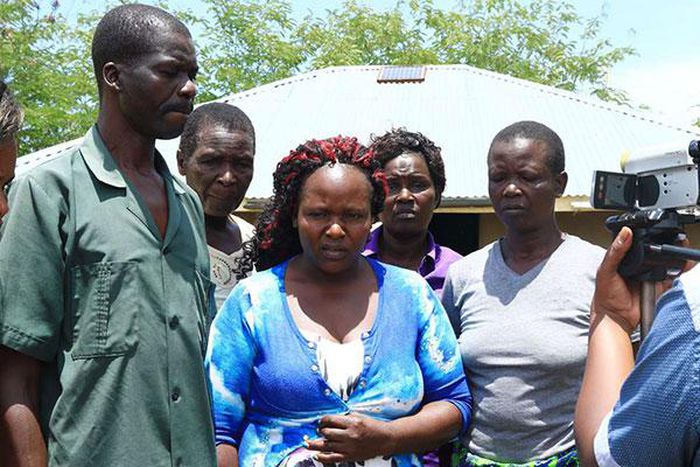 Sharon Otieno's father Douglas Otieno (left) and mother Melida Auma (centre) joined by their relatives