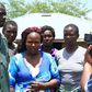 Sharon Otieno's father Douglas Otieno (left) and mother Melida Auma (centre) joined by their relatives