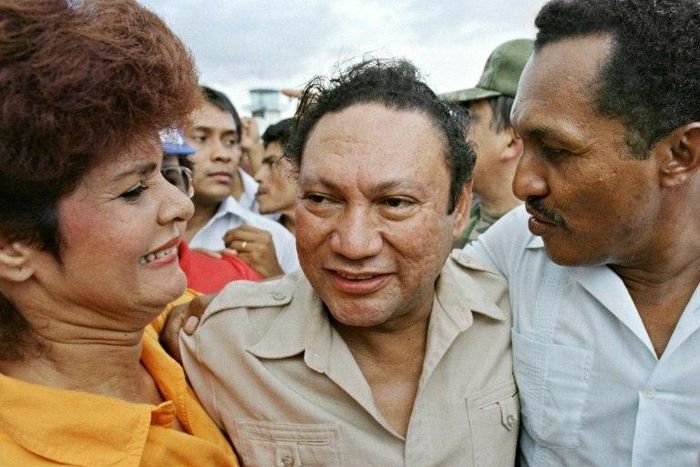 Panamanian dictator Manuel Antonio Noriega hugs supporters on a visit to a remote town in June 1987