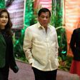 Philippine President Rodrigo Duterte (C) and his partner Honeylet Avancena (L) arrive to meet leaders upon their arrival for the opening ceremony of the Association of Southeast Asian Nations (ASEAN) leaders' summit in Manila