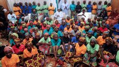 Nigeria's President Muhammadu Buhari (centre) met the 82 rescued Chibok girls after their release in a prisoner swap deal