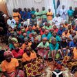 Nigeria's President Muhammadu Buhari (C) sits among the 82 rescued Chibok girls during a reception ceremony at the Presidential Villa in Abuja, on May 7, 2017