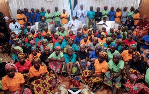 Nigeria's President Muhammadu Buhari (centre) met the 82 rescued Chibok girls after their release in a prisoner swap deal