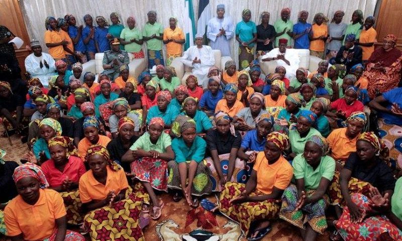 Nigeria's President Muhammadu Buhari (centre) met the 82 rescued Chibok girls after their release in a prisoner swap deal