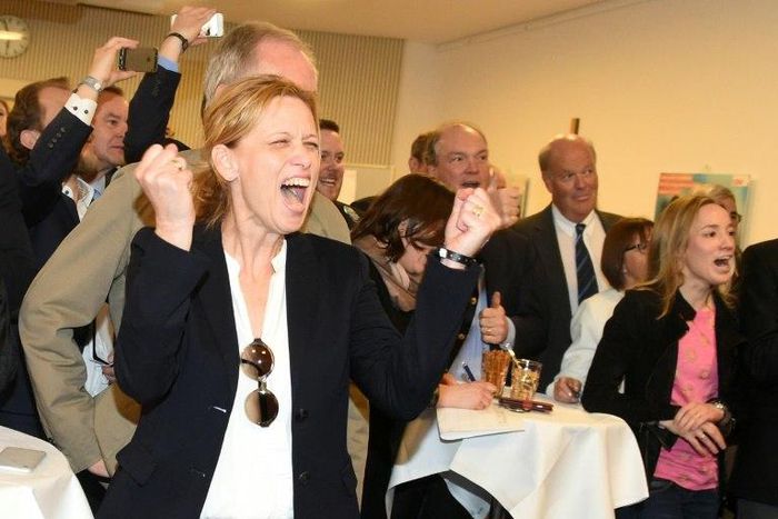 Karin Prien (R) and members of the Conservative Christian Democrats (CDU) party react to election results in Schleswig-Holstein state elections in Kiel, northern Germany, on May 7, 2017