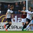 Tottenham Hotspur's Eric Dier (C) celebrates with teammates after scoring the opening goal against Burnley on April 1, 2017