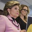 Attorney Gloria Allred holds a photo of Jessica Drake (R) with Donald Trump, taken in 2006 during an event where Drake alleges Trump behaved in an sexually inappropriate way toward her