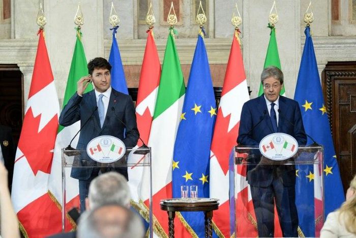 Italy's Paolo Gentiloni (right) said the importance of transatlantic ties should not lead Europe to renounce 'fundamental principles such as our commitments against climate change'