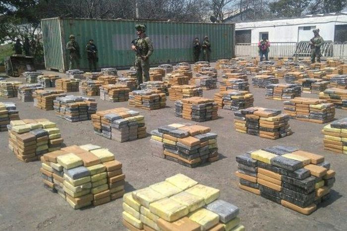 This handout picture released by the Colombian Antinarcotics Police shows 6,184 kilos of cocaine -which was heading to the port of Algeciras, Spain- seized in Barranquilla, on April 2, 2017