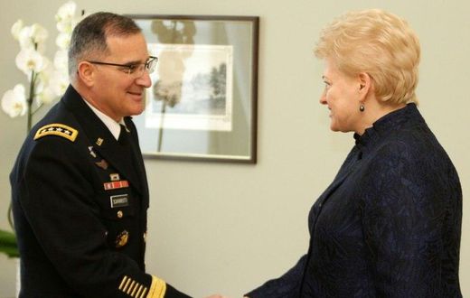 Lithuania's President Dalia Grybauskaite (R) shakes hand with Curtis Michael Scaparrotti, a four-star general in the US Army and Supreme Allied Commander Europe of NATO Allied Command Operations, during an official meeting in Vilnius on March 16, 2017