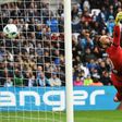 Dijon's Baptiste Reynet fails to stop a shot by Marseille's Dimitri Payet during their match at the Velodrome stadium in Marseille on April 1, 2017