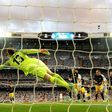 Atletico Madrid's goalkeeper Jan Oblak stops the ball during their UEFA Champions League semi-final 1st leg match against Real Madrid, at the Santiago Bernabeu stadium in Madrid, on May 2, 2017
