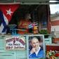 A farmer decorates his stall as he waits for the urn with the ashes of Cuban leader Fidel Castro to be driven through the streets of Las Tunas