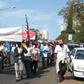 Demonstrators carrying a banner reading "Association of Former Mozambican Workers in Germany" march in Maputo over unpaid wages