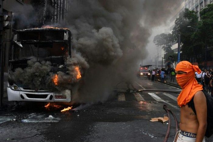 Buses were torched as Brazilian anti-austerity protesters clashed with riot police in Rio de Janeiro, on February 1, 2017