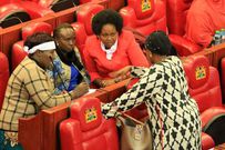 Some MPs hold a discussion during the debate on the Constitution of Kenya (Amendment) Bill 2018 in the House