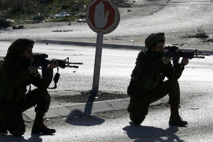 Israeli soldiers and Palestinian stone throwers clash east of Nablus, in the occupied West Bank