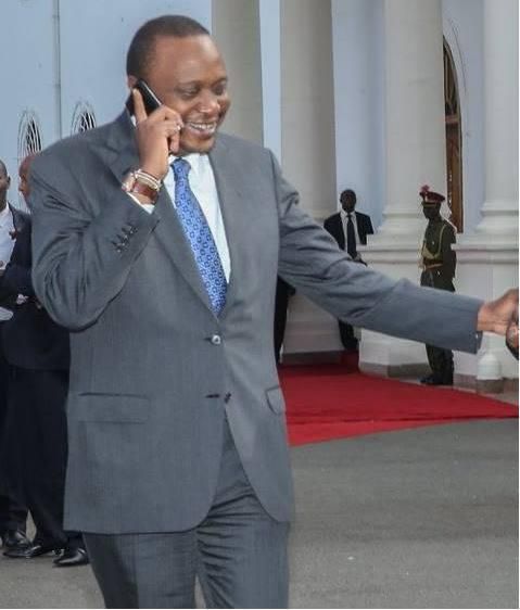 File image of President Uhuru Kenyatta on phone