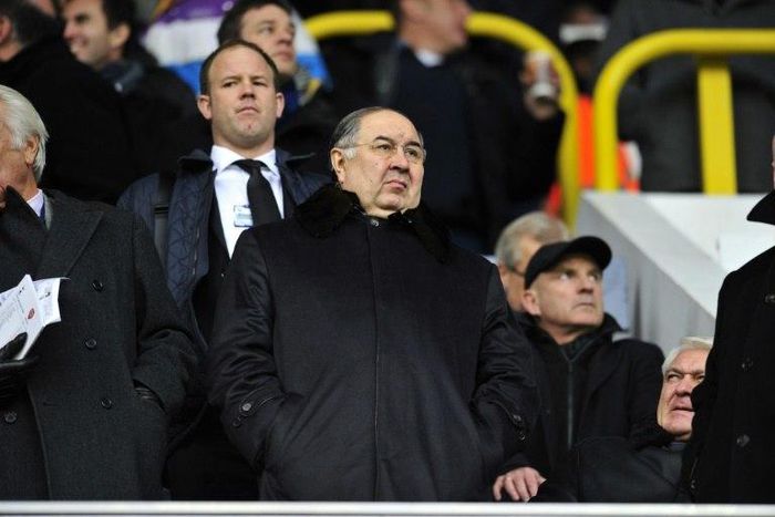 Russian shareholder Alisher Usmanov (C), who owns 30 percent of Arsenal, has already had a previous bid for the Premiere League club rejected