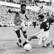 Brazilian soccer legend Mane Garrincha vies for the ball with Wales' Mel Hopkins in the World Cup quarter finals in June 1958