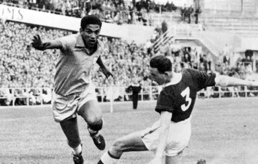 Brazilian soccer legend Mane Garrincha vies for the ball with Wales' Mel Hopkins in the World Cup quarter finals in June 1958