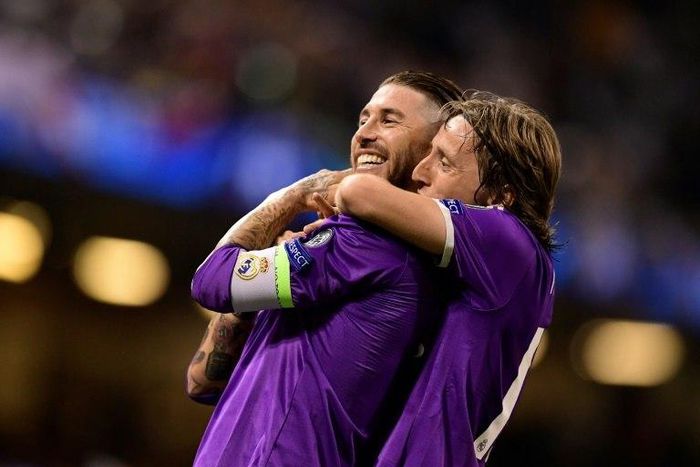 Real Madrid's Sergio Ramos (L) and Luka Modric celebrate after Real score their fourth goal during the UEFA Champions League final football match against Juventus in Cardiff on June 3, 2017