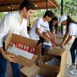Alfred Santamaria packs medical supplies to send to protesters in Venezuela at the "Solidaridad Venezuela" event in Hialeah, Florida on May 13, 2017