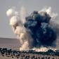 An air strike by a Turkish jet fighter hits the Syrian village of Jarabulus on the Syrian-Turkish border during fighting against the IS group on August 24, 2016