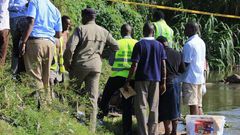 Police detectives and crime forensic officers at a crime scene in the past.