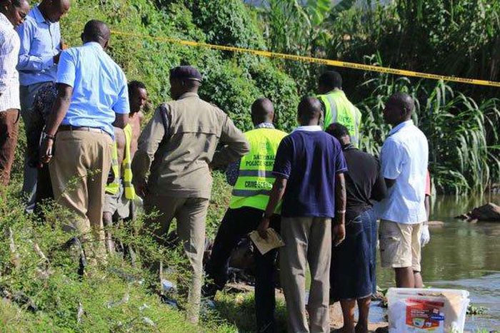 Police detectives and crime forensic officers at a crime scene in the past.