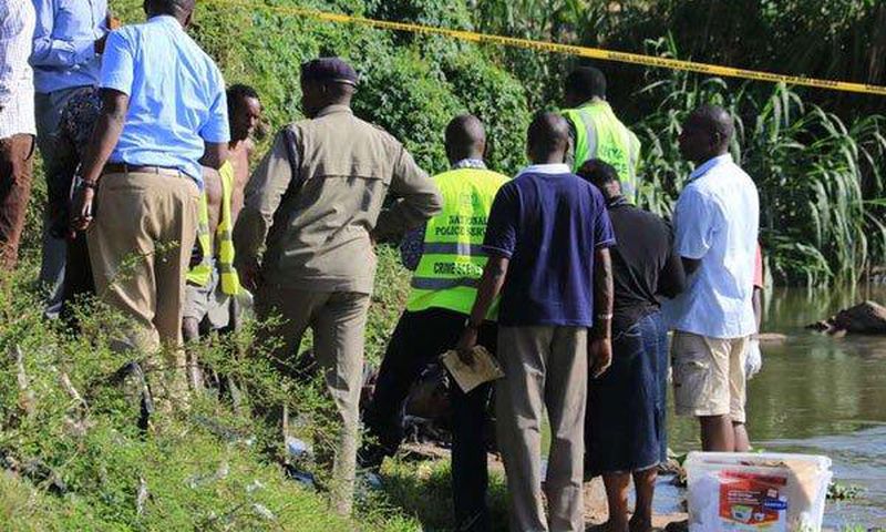 Police detectives and crime forensic officers at a crime scene in the past.