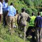 Police detectives and crime forensic officers at a crime scene in the past.